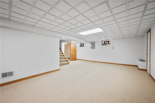 basement featuring carpet floors and electric panel