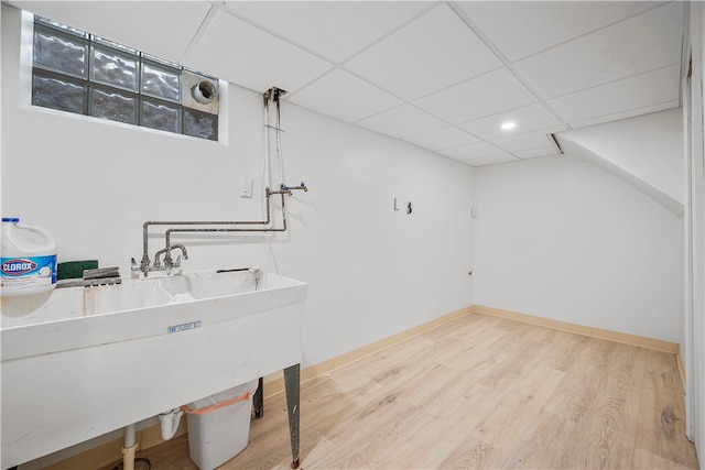 laundry area featuring hardwood / wood-style floors