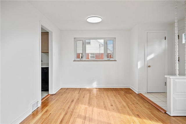 unfurnished room featuring light hardwood / wood-style floors