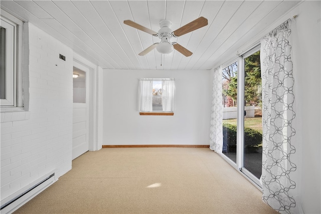 interior space featuring ceiling fan, wood ceiling, and baseboard heating