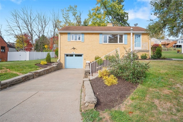 view of front facade with a front yard and a garage