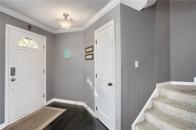 foyer featuring crown molding and dark hardwood / wood-style floors