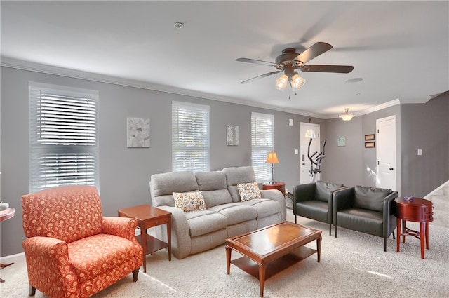 carpeted living room with ornamental molding, ceiling fan, and a wealth of natural light