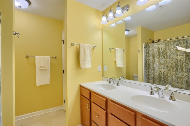 bathroom with toilet, vanity, a shower with shower curtain, and tile patterned flooring