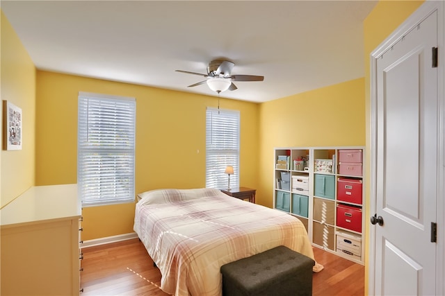 bedroom featuring light hardwood / wood-style flooring and ceiling fan