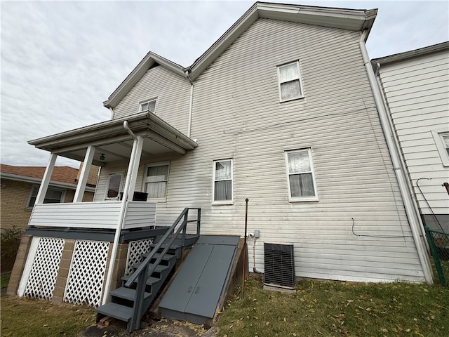 back of house with central AC