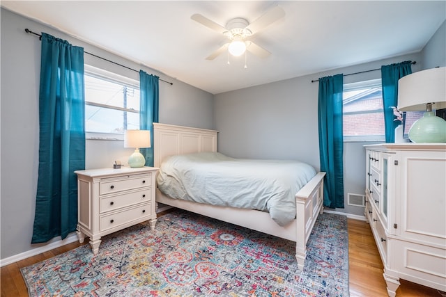 bedroom featuring light hardwood / wood-style flooring and ceiling fan