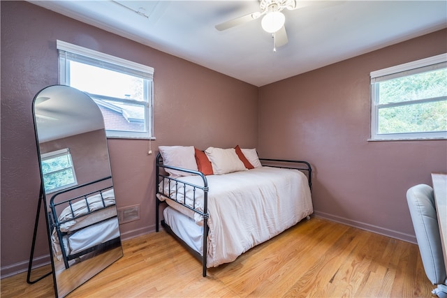 bedroom featuring light hardwood / wood-style floors and ceiling fan