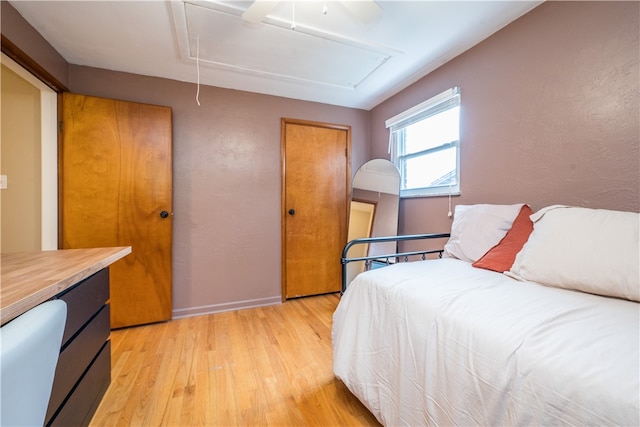 bedroom featuring ceiling fan and light hardwood / wood-style flooring