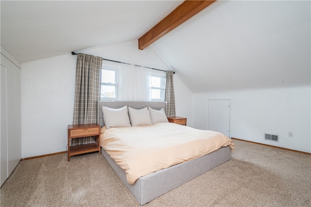 bedroom featuring vaulted ceiling with beams and carpet