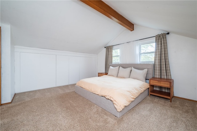 bedroom featuring carpet floors and lofted ceiling with beams