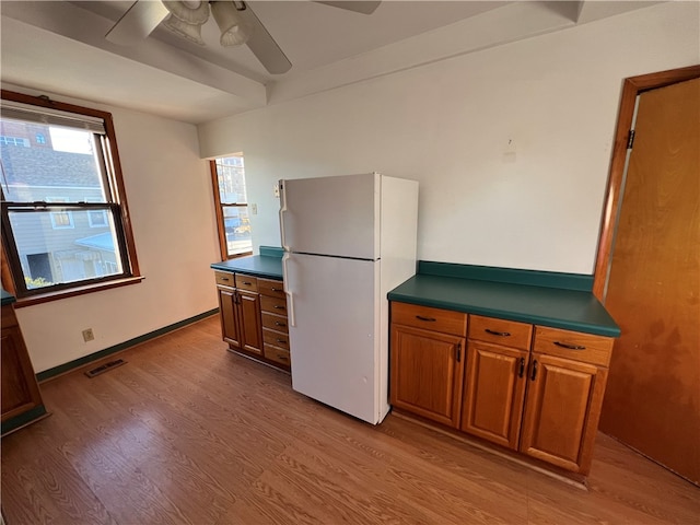 kitchen with ceiling fan, light wood-type flooring, and white refrigerator