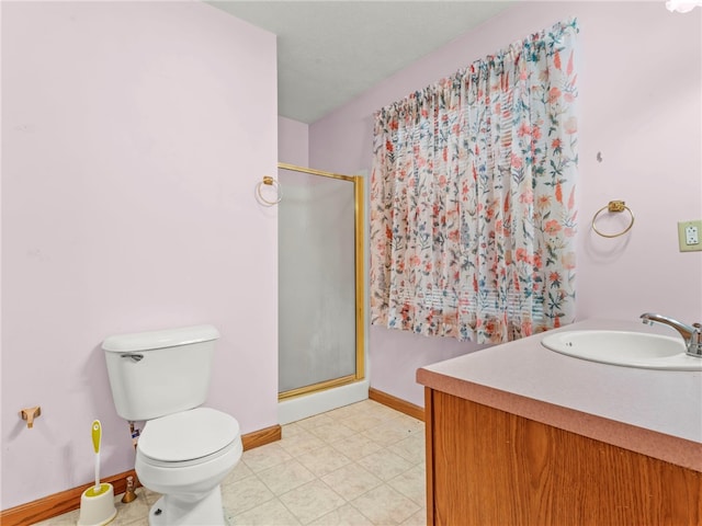 bathroom with vanity, toilet, tile patterned flooring, and a shower with door