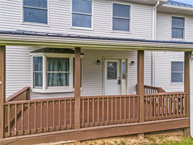 entrance to property with a wooden deck