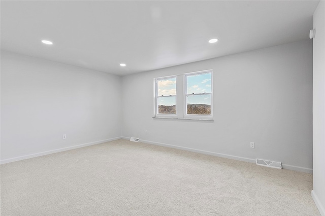 unfurnished room featuring carpet flooring