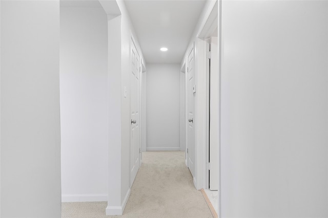 corridor with light colored carpet