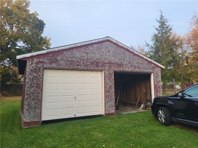 garage with a lawn