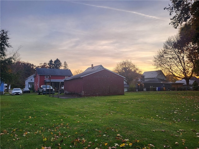 view of yard at dusk