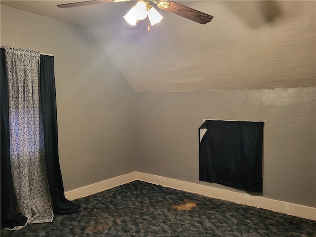 bonus room with ceiling fan, carpet flooring, and vaulted ceiling