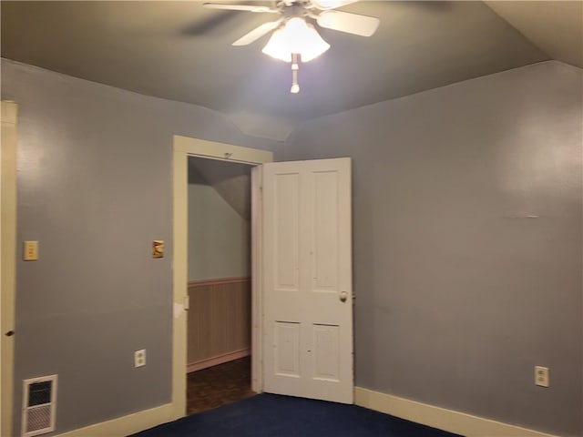 interior space featuring lofted ceiling and ceiling fan