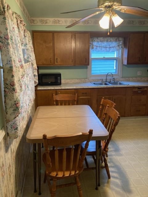 kitchen with ceiling fan and sink