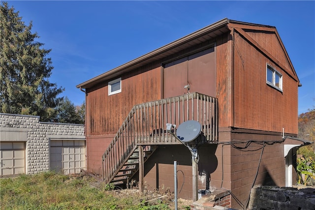 view of side of home featuring a garage