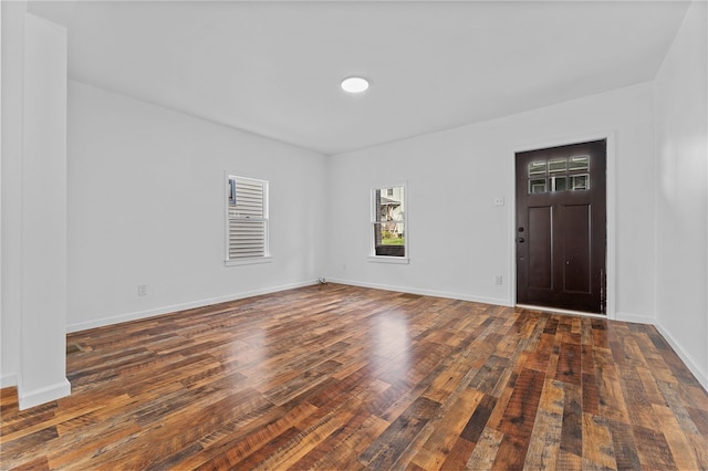 spare room featuring dark hardwood / wood-style flooring