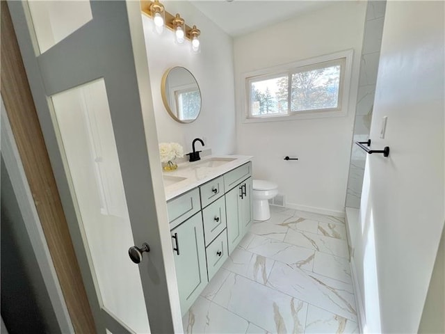 bathroom with vanity and toilet