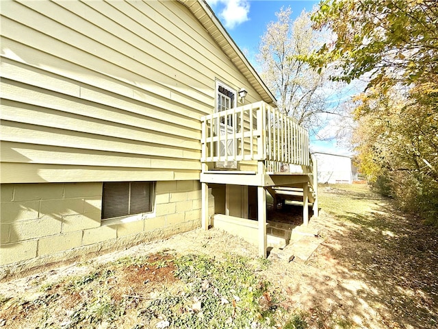 view of side of property featuring a deck