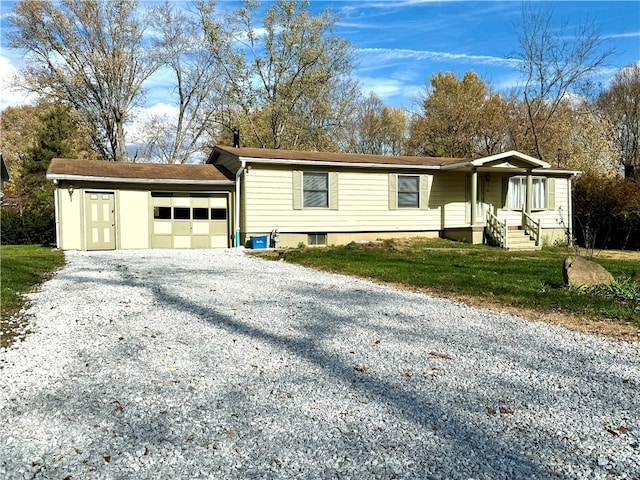 view of front of home with a garage and a front lawn