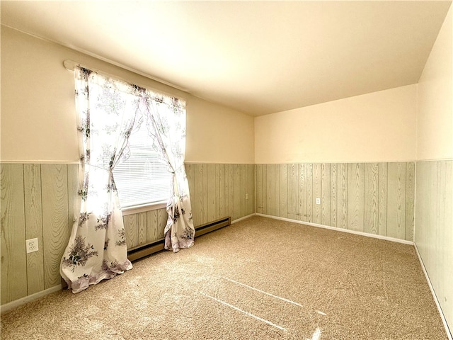 carpeted empty room with wood walls