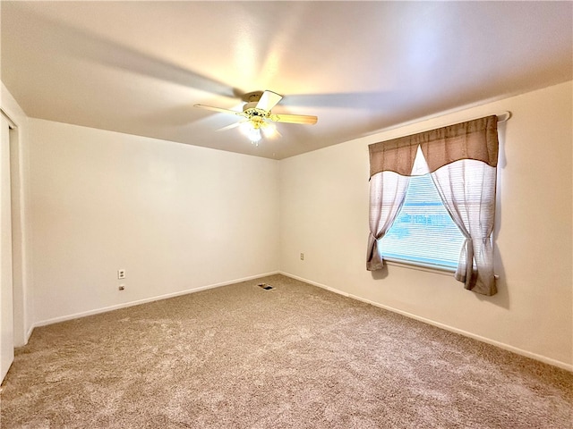 empty room with carpet and ceiling fan