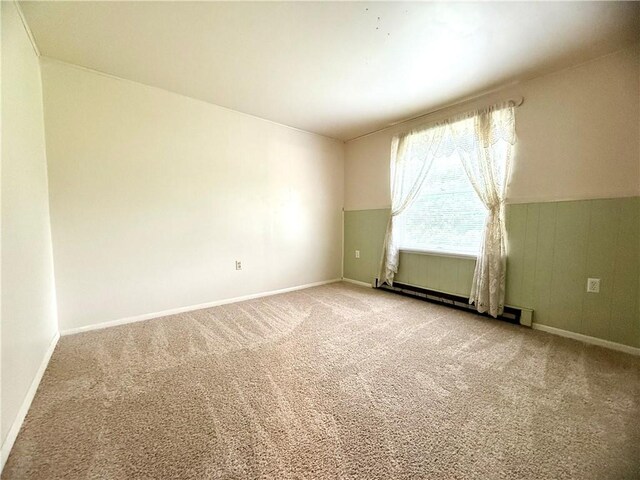226 Cottage Ave, Masontown, PA 15461 - unfurnished room featuring light carpet, baseboards, and a baseboard heating unit