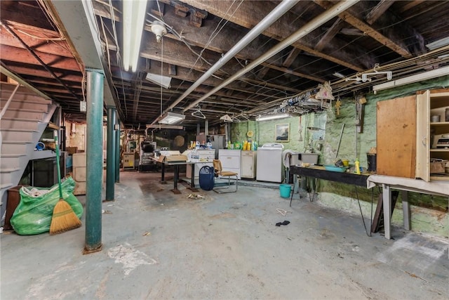 basement with washing machine and clothes dryer