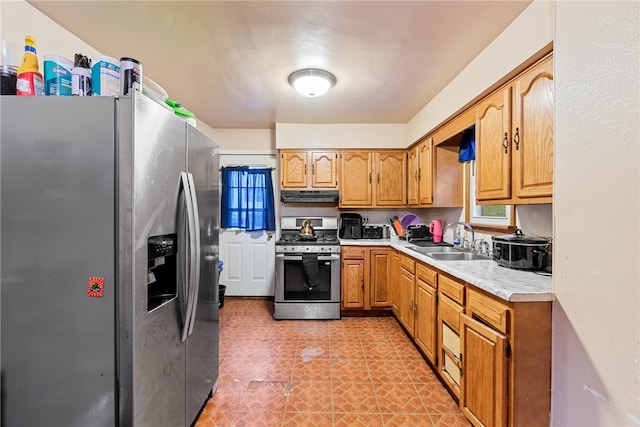 kitchen with appliances with stainless steel finishes and sink