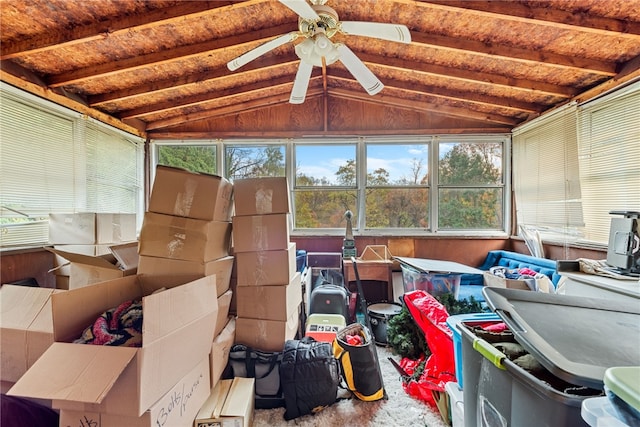 sunroom featuring lofted ceiling with beams and ceiling fan