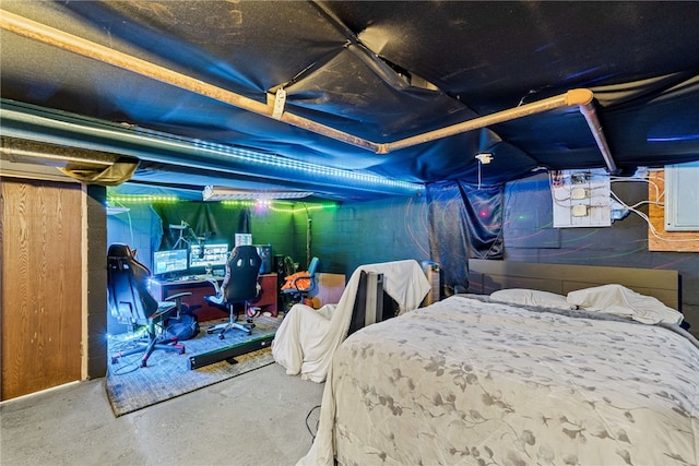 bedroom featuring concrete flooring