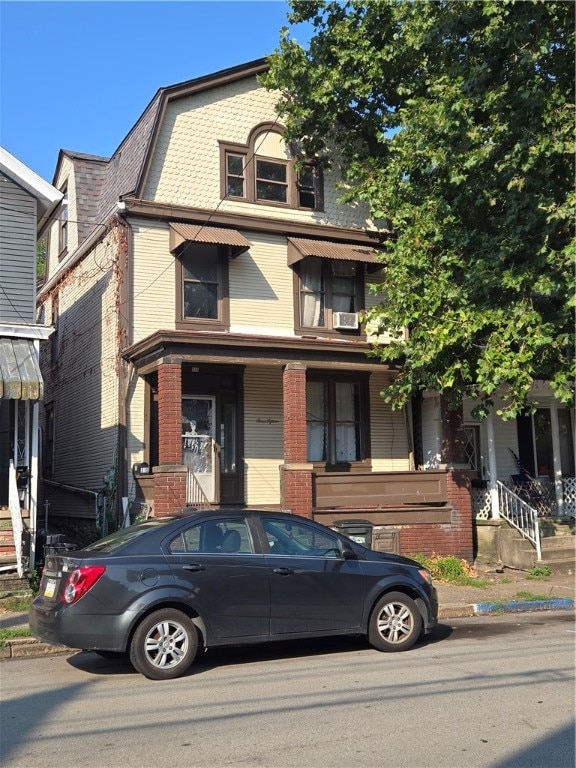 view of front of house featuring cooling unit