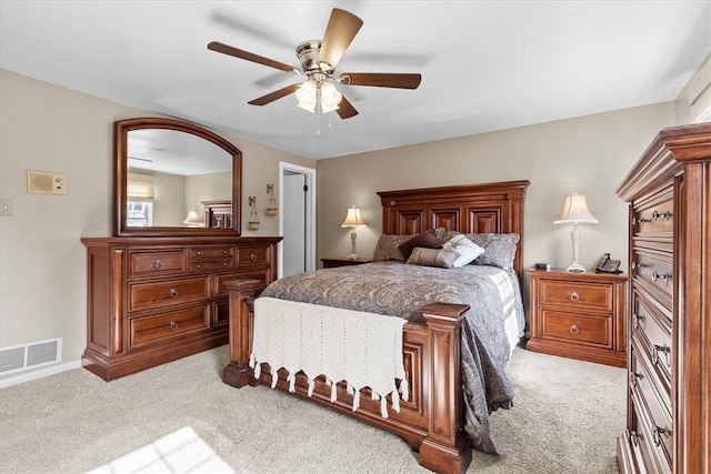 bedroom with light carpet and ceiling fan