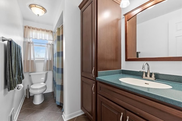 bathroom featuring vanity, a shower with shower curtain, toilet, and tile patterned flooring