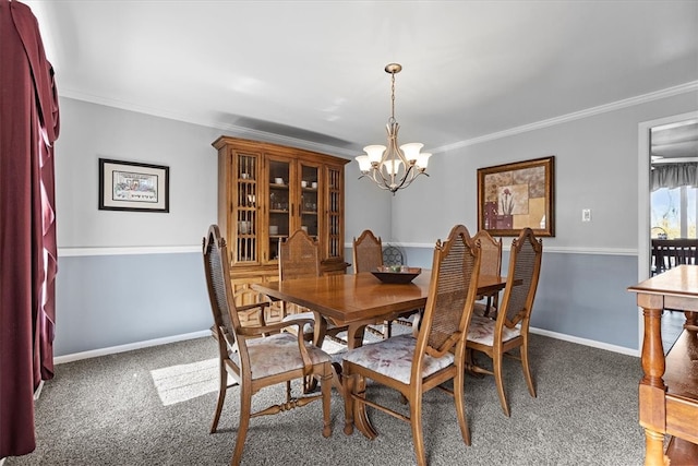 dining area with dark carpet, crown molding, and a chandelier