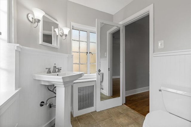 bathroom with toilet and radiator