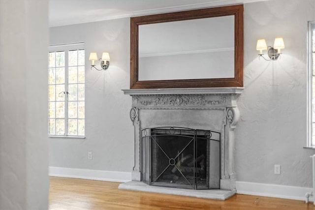 room details with crown molding and hardwood / wood-style flooring