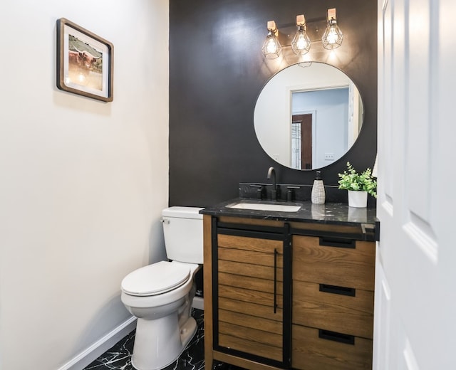 bathroom with tile patterned floors, vanity, and toilet