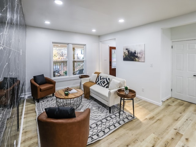 living room with light hardwood / wood-style floors