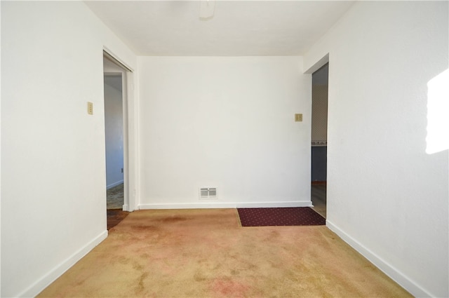 spare room featuring carpet