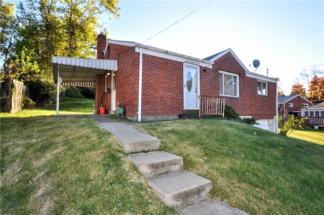 view of front facade with a front yard and a carport