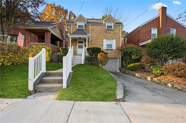 view of front facade featuring a front yard and a garage