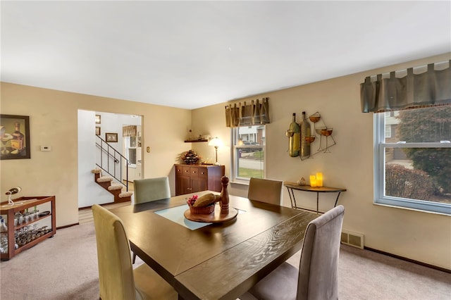 dining area with light carpet