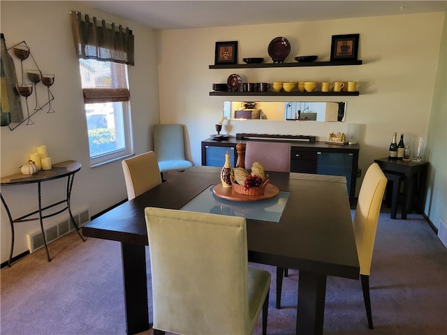 view of carpeted dining space